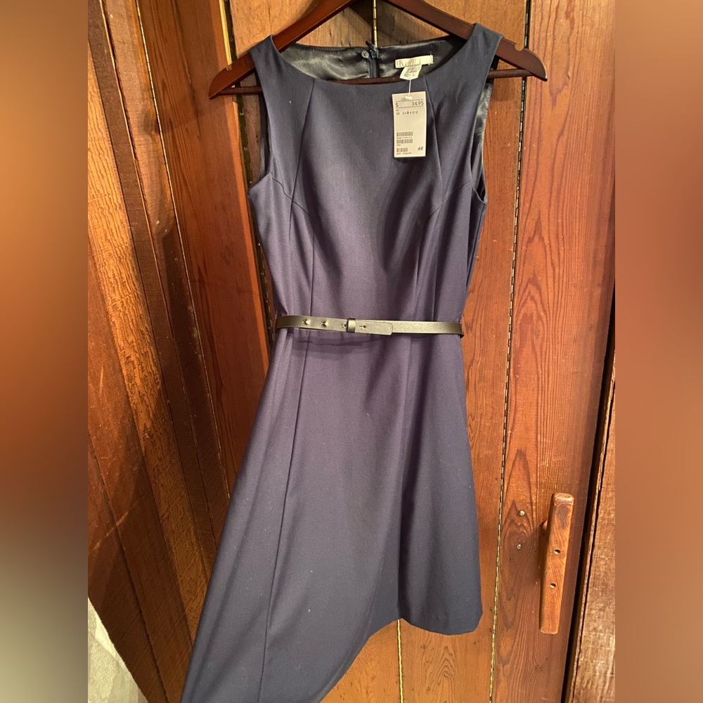 Navy blue H&M dress. Black belt. Size 6. New tags on.